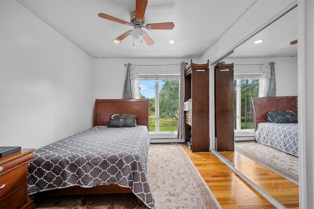 15 Oakhurst St, Huntington Station, NY 11746 - bedroom with multiple windows, light wood-style floors, recessed lighting, and a ceiling fan