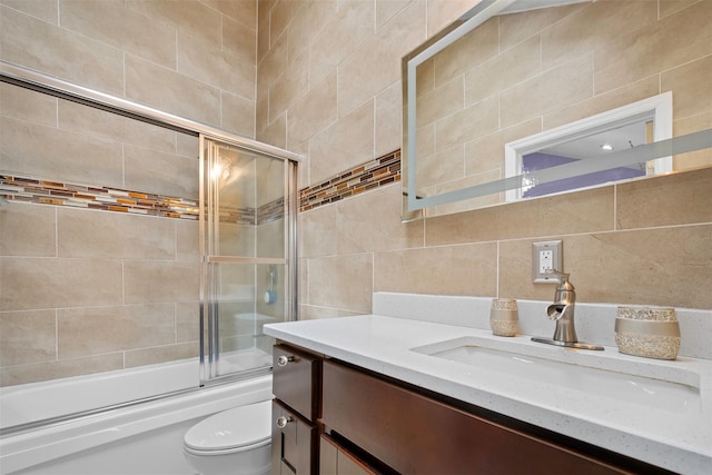 15 Oakhurst St, Huntington Station, NY 11746 - bathroom featuring tile walls, vanity, enclosed tub / shower combo, and backsplash