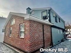 164-34 77th Ave, Fresh Meadows, NY 11366 - view of side of property with brick siding