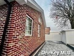 164-34 77th Ave, Fresh Meadows, NY 11366 - view of side of home with brick siding