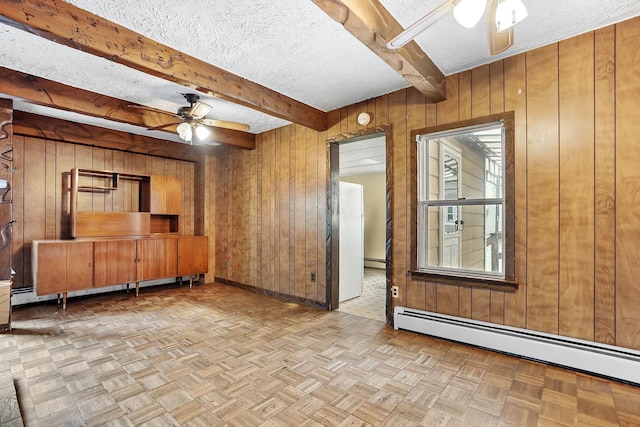 53 Howard St, Mount Vernon, NY 10550 - unfurnished living room featuring a ceiling fan, baseboard heating, wood walls, beam ceiling, and a textured ceiling