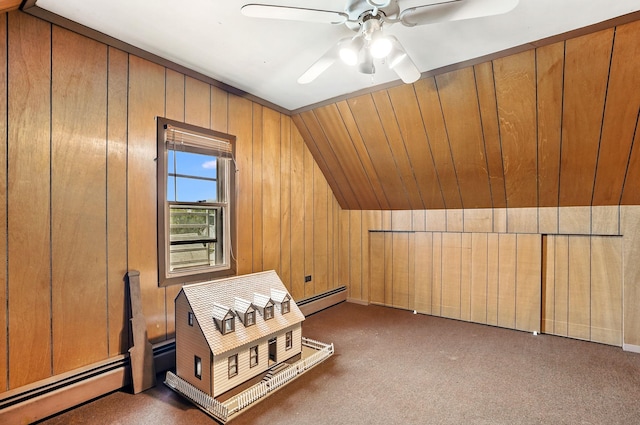 53 Howard St, Mount Vernon, NY 10550 - bonus room featuring vaulted ceiling, ceiling fan, wooden walls, carpet flooring, and a baseboard radiator