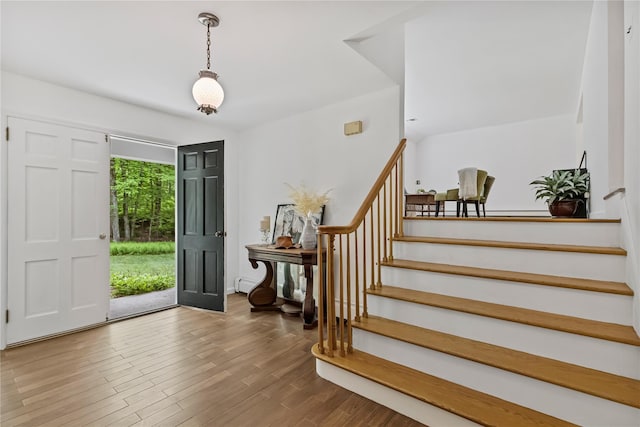 foyer with stairs and wood finished floors