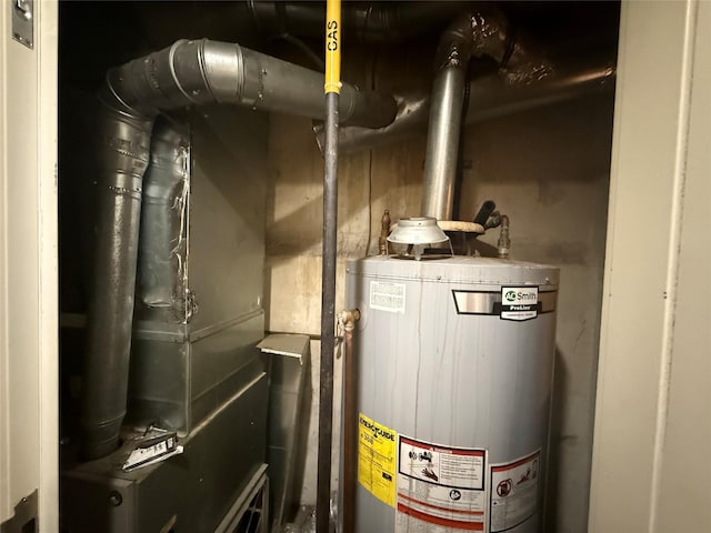 69-11 58th Rd, Maspeth, NY 11378 - utility room featuring water heater
