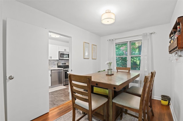 121 N Broadway Unit 22F, White Plains, NY 10603 - dining room with wood finished floors and baseboards