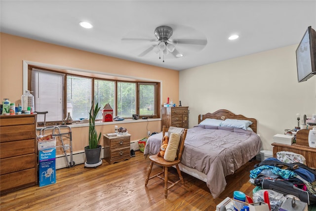 626 Union Ave, New Windsor, NY 12553 - bedroom with wood finished floors, a baseboard radiator, recessed lighting, and ceiling fan