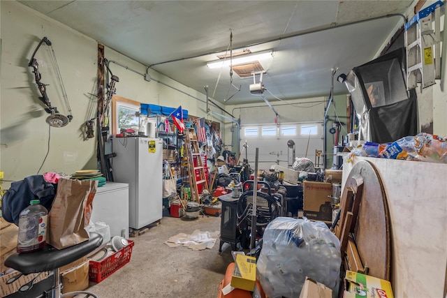 626 Union Ave, New Windsor, NY 12553 - garage featuring refrigerator and a garage door opener