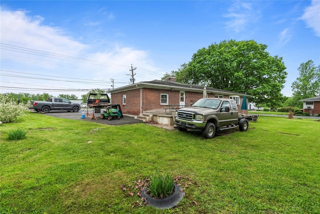 626 Union Ave, New Windsor, NY 12553 - view of property exterior featuring brick siding, a chimney, and a yard