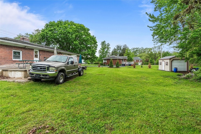 626 Union Ave, New Windsor, NY 12553 - view of green lawn featuring an outdoor structure, a detached garage, and a storage shed