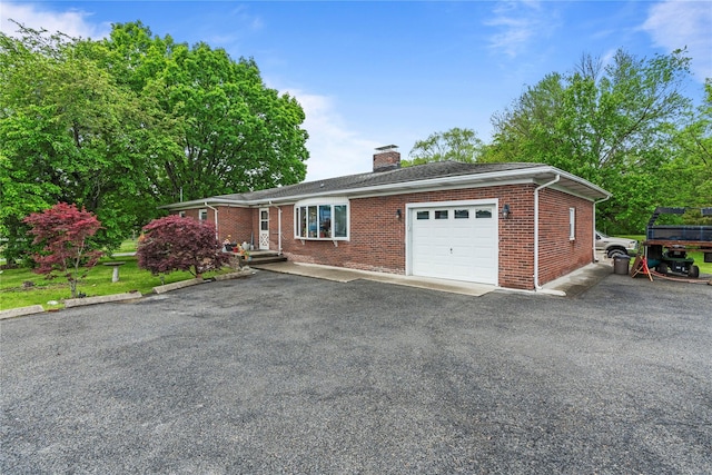 626 Union Ave, New Windsor, NY 12553 - ranch-style house featuring an attached garage, a chimney, brick siding, and driveway