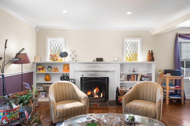 2944 Tulip Ave, Baldwin, NY 11510 - living room with wood finished floors, a brick fireplace, crown molding, and recessed lighting