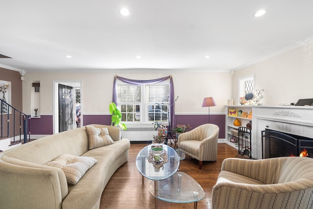 2944 Tulip Ave, Baldwin, NY 11510 - living room with plenty of natural light, ornamental molding, recessed lighting, stairway, and radiator