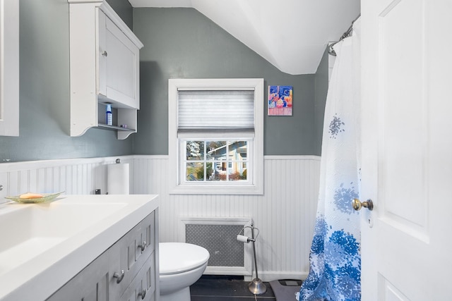 2944 Tulip Ave, Baldwin, NY 11510 - full bath with a wainscoted wall, toilet, vanity, radiator heating unit, and tile patterned flooring