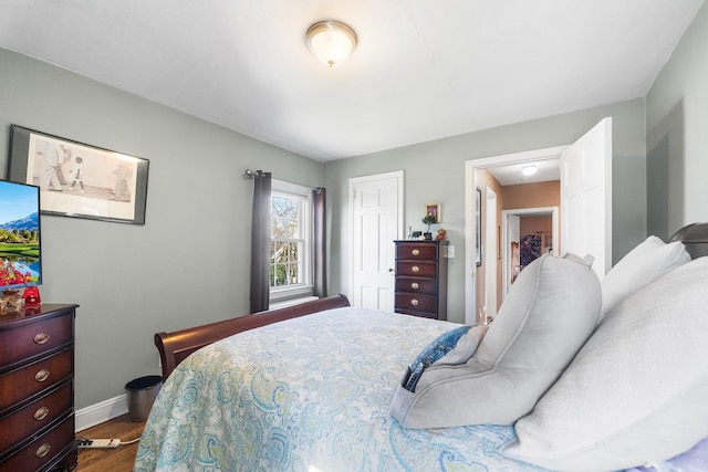 2944 Tulip Ave, Baldwin, NY 11510 - bedroom featuring dark wood-style floors, baseboards, and a closet