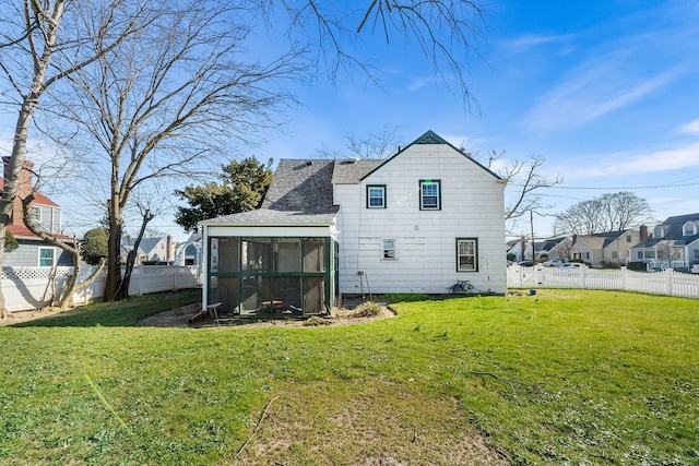 2944 Tulip Ave, Baldwin, NY 11510 - back of property featuring a sunroom, roof with shingles, and a residential view