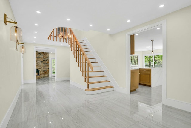 7 Mcculloch Dr, Dix Hills, NY 11746 - stairs featuring recessed lighting, baseboards, and a stone fireplace