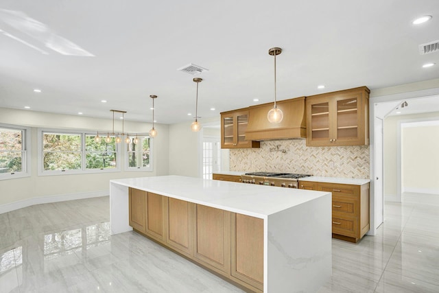 7 Mcculloch Dr, Dix Hills, NY 11746 - kitchen with backsplash, glass insert cabinets, light countertops, a spacious island, and baseboards