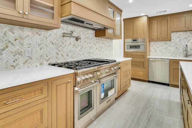 7 Mcculloch Dr, Dix Hills, NY 11746 - kitchen featuring stainless steel appliances, custom range hood, backsplash, light countertops, and glass insert cabinets