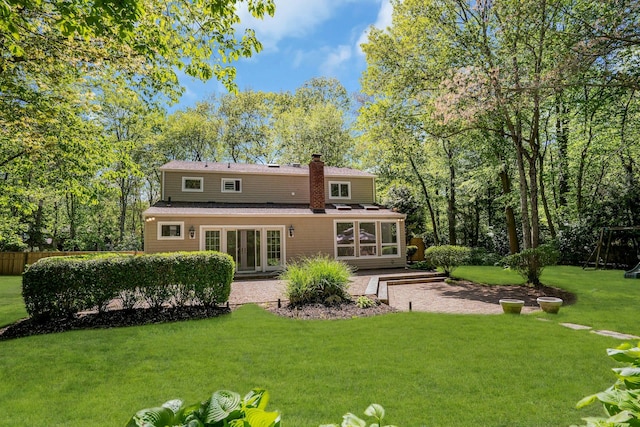 7 Mcculloch Dr, Dix Hills, NY 11746 - rear view of property with a lawn, a chimney, a patio, and roof with shingles