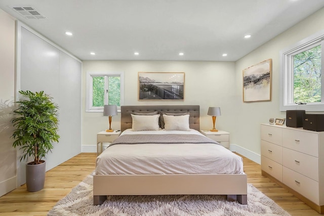 7 Mcculloch Dr, Dix Hills, NY 11746 - bedroom featuring light wood finished floors, multiple windows, recessed lighting, and baseboards