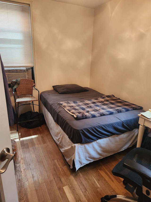 139-15 83rd Ave Unit 330, Briarwood, NY 11435 - bedroom with wood-type flooring and cooling unit