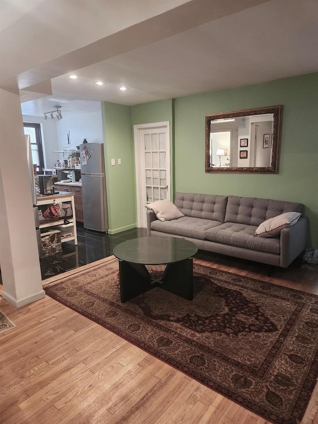 139-15 83rd Ave Unit 330, Briarwood, NY 11435 - living room featuring wood finished floors, recessed lighting, and baseboards
