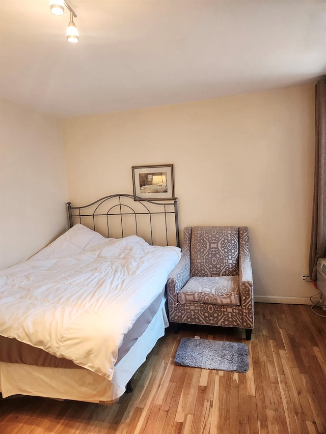 139-15 83rd Ave Unit 330, Briarwood, NY 11435 - bedroom with wood finished floors and track lighting