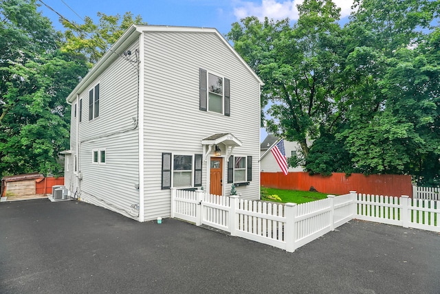 1755 Parmly Rd, Mohegan Lake, NY 10547 - view of front of home featuring a fenced front yard and asphalt driveway