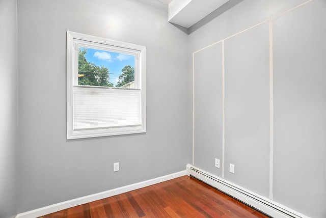 1755 Parmly Rd, Mohegan Lake, NY 10547 - empty room with a baseboard radiator and dark wood finished floors