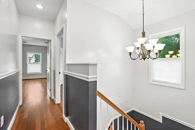 1755 Parmly Rd, Mohegan Lake, NY 10547 - hallway with an upstairs landing, a chandelier, dark wood-type flooring, and vaulted ceiling