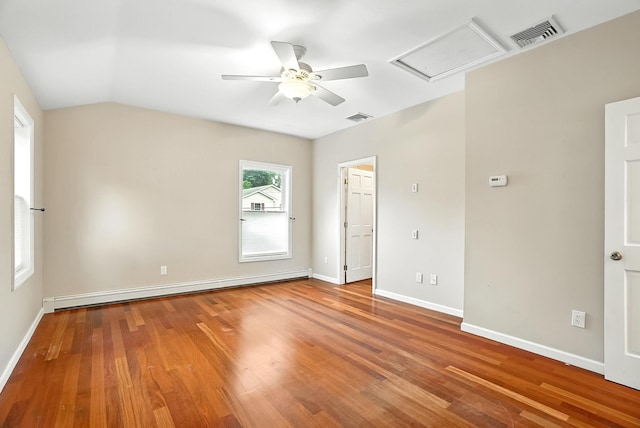 1755 Parmly Rd, Mohegan Lake, NY 10547 - unfurnished bedroom featuring a baseboard heating unit, wood finished floors, ceiling fan, and vaulted ceiling