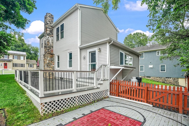 1755 Parmly Rd, Mohegan Lake, NY 10547 - rear view of house with a patio area and a wooden deck