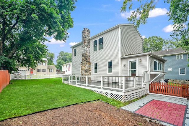 1755 Parmly Rd, Mohegan Lake, NY 10547 - rear view of property featuring a chimney, a patio, and a wooden deck