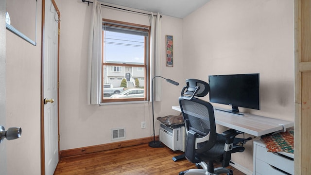 office featuring wood finished floors and baseboards