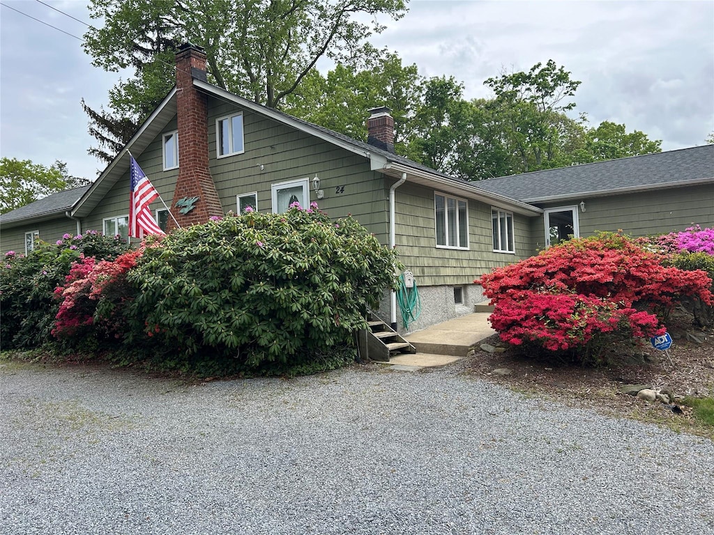 view of side of home with a chimney