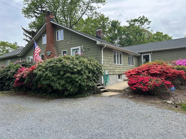 view of side of home with a chimney