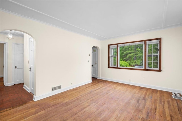 2 Ashley Rd, Hastings-On-Hudson, NY 10706 - unfurnished room with arched walkways, baseboards, and wood finished floors