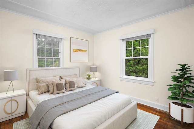 2 Ashley Rd, Hastings-On-Hudson, NY 10706 - bedroom with ornamental molding, multiple windows, dark wood-style floors, baseboards, and a textured ceiling