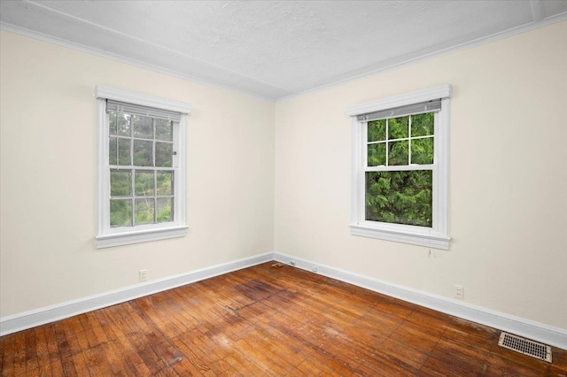 2 Ashley Rd, Hastings-On-Hudson, NY 10706 - spare room featuring crown molding, healthy amount of natural light, baseboards, hardwood / wood-style flooring, and a textured ceiling
