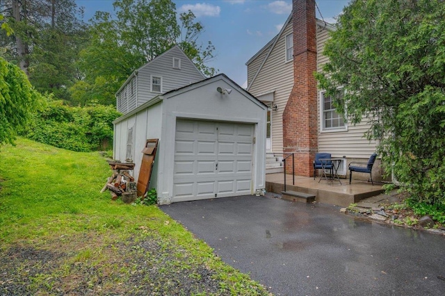 2 Ashley Rd, Hastings-On-Hudson, NY 10706 - garage featuring asphalt driveway