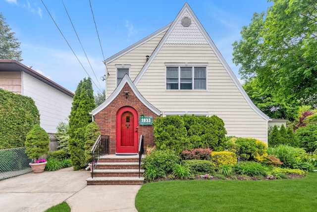 1833 Gregory Ave, Merrick, NY 11566 - english style home with a front lawn and brick siding