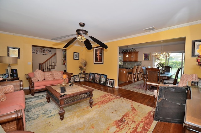 1793 Brian Ct, South Merrick, NY 11566 - living area with a ceiling fan, dark wood-style flooring, crown molding, stairs, and a chandelier
