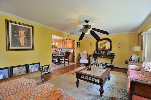 1793 Brian Ct, South Merrick, NY 11566 - living area with dark wood-style floors, crown molding, a ceiling fan, a chandelier, and baseboards