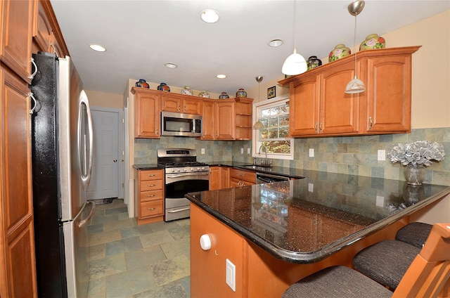 1793 Brian Ct, South Merrick, NY 11566 - kitchen featuring stainless steel appliances, a peninsula, a sink, recessed lighting, and tasteful backsplash