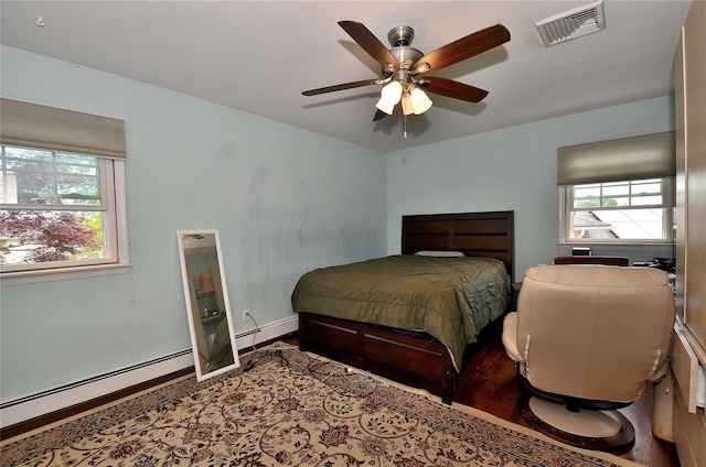 1793 Brian Ct, South Merrick, NY 11566 - bedroom featuring wood finished floors, ceiling fan, baseboards, and a baseboard radiator