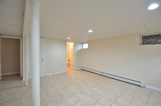 1793 Brian Ct, South Merrick, NY 11566 - basement featuring a baseboard radiator, recessed lighting, light tile patterned floors, a drop ceiling, and baseboards
