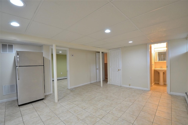 1793 Brian Ct, South Merrick, NY 11566 - finished below grade area featuring freestanding refrigerator, a sink, light tile patterned floors, baseboards, and recessed lighting