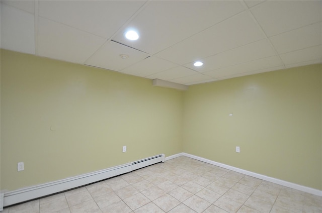 1793 Brian Ct, South Merrick, NY 11566 - spare room featuring a baseboard heating unit, recessed lighting, a paneled ceiling, and baseboards
