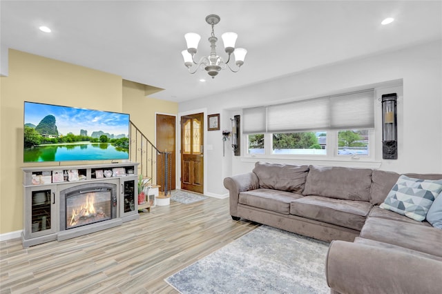 220 Boundary Ave, Massapequa, NY 11758 - living area with a chandelier, wood finished floors, baseboards, recessed lighting, and stairs