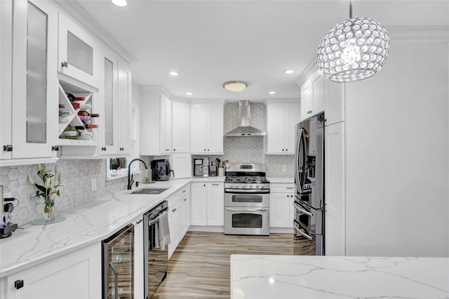 220 Boundary Ave, Massapequa, NY 11758 - kitchen with stainless steel appliances, wall chimney exhaust hood, a sink, wine cooler, and white cabinets